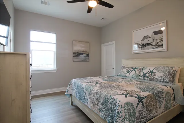 a bedroom with a bed and a night stand