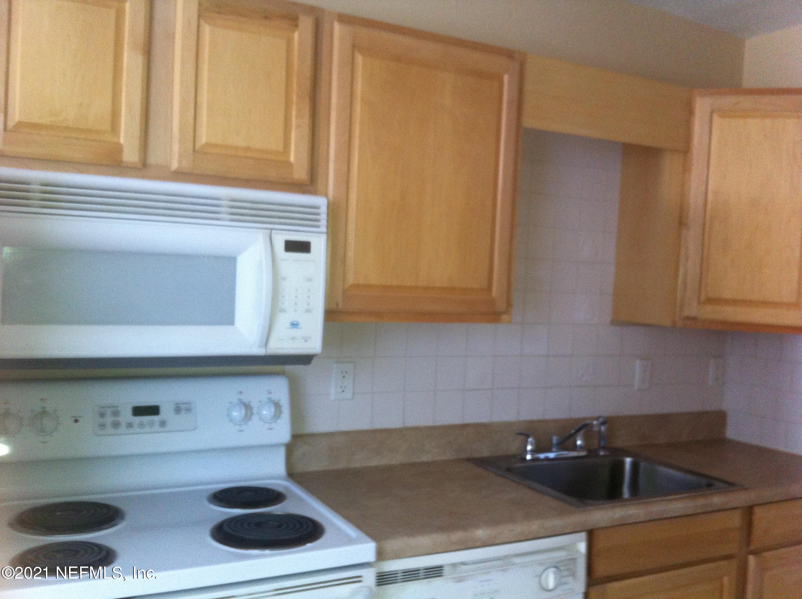 698 Kestner Road Atlantic Beach, FL 32233 - Photo 8 of 8 a kitchen with a sink and cabinets