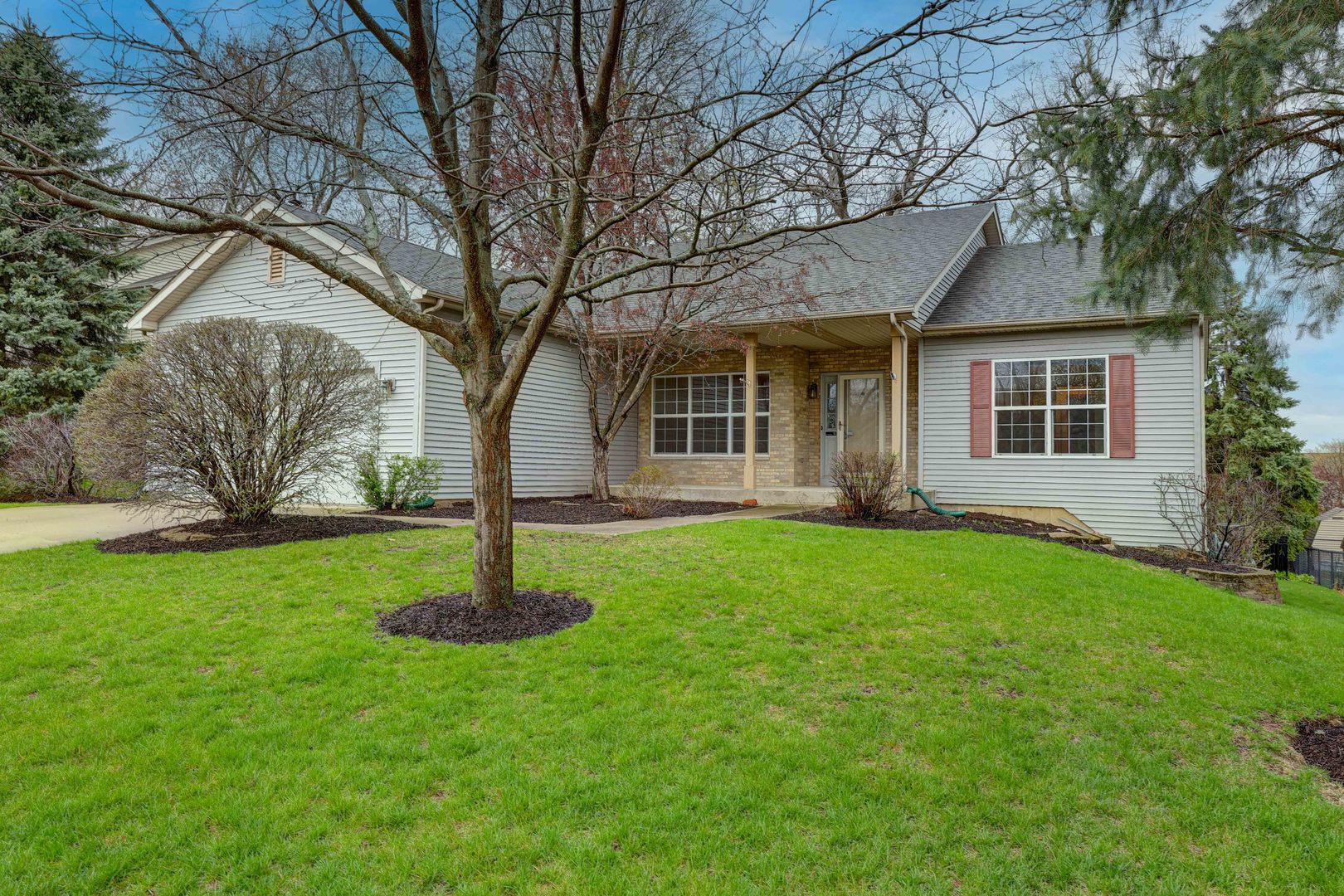a house with garden in front of it
