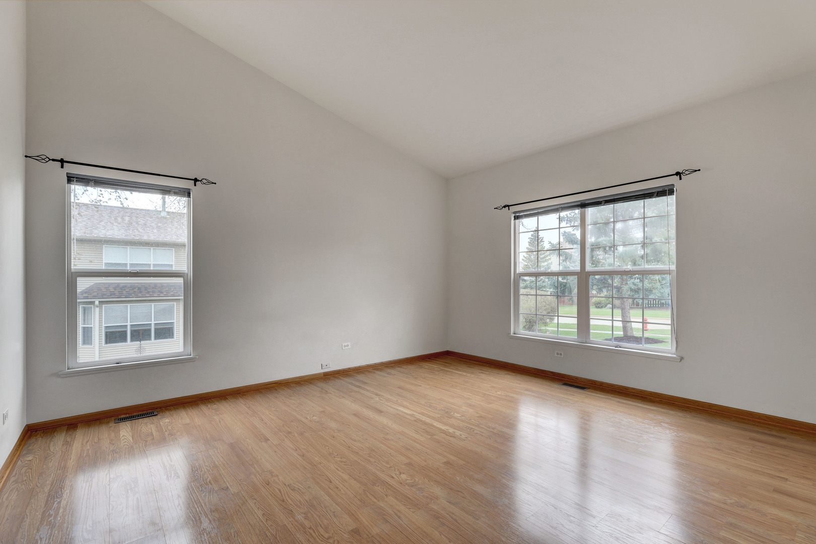 3206 Chestnut Drive McHenry, IL 60051 - Photo 15 of 30 a view of an empty room with wooden floor and a window