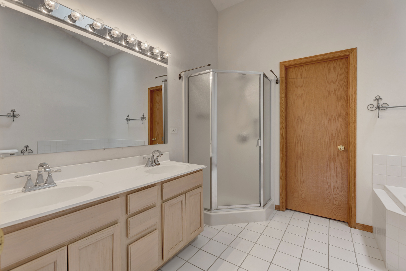 3206 Chestnut Drive McHenry, IL 60051 - Photo 17 of 30 a spacious bathroom with a double vanity sink a mirror and a shower