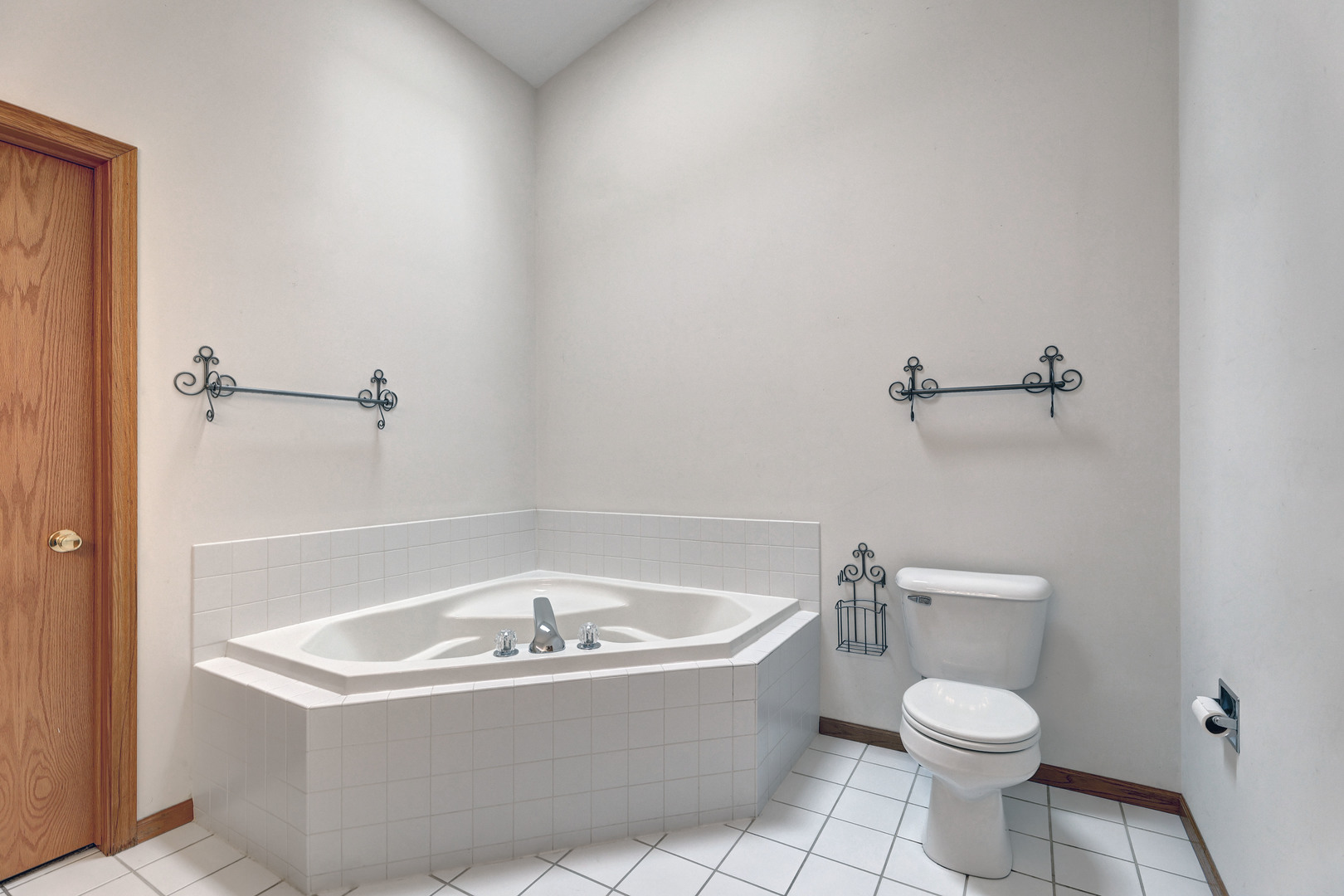 3206 Chestnut Drive McHenry, IL 60051 - Photo 18 of 30 a white bath tub sitting next to a white toilet