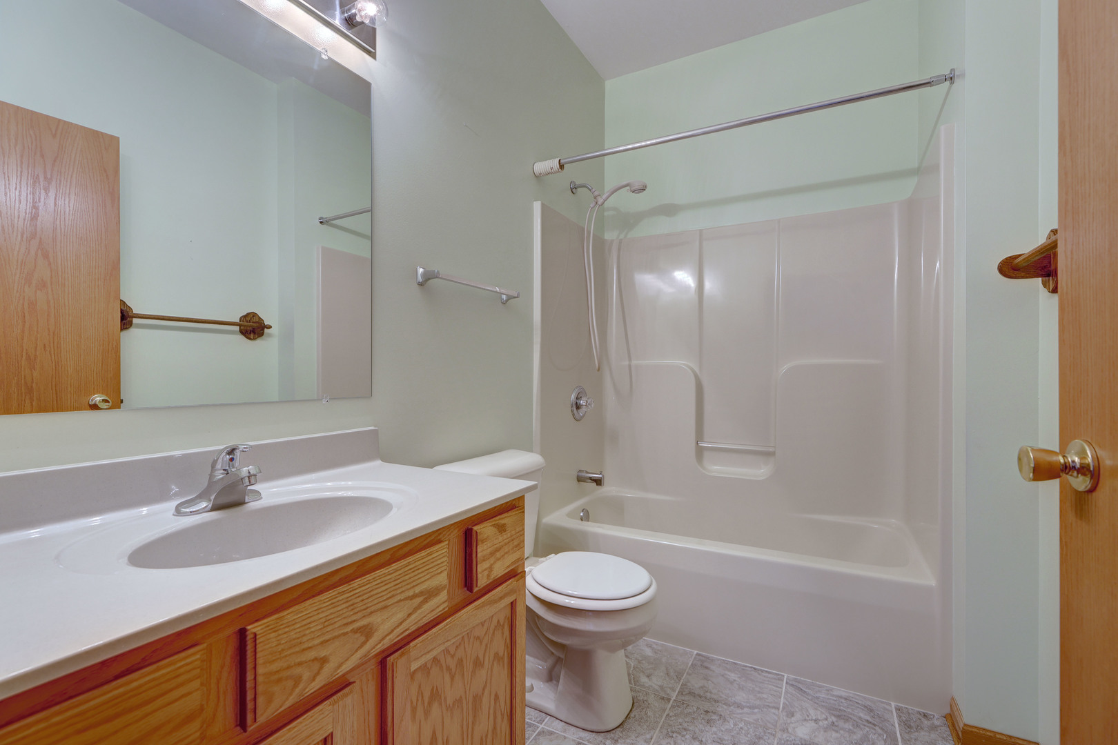 3206 Chestnut Drive McHenry, IL 60051 - Photo 24 of 30 a bathroom with a sink toilet a mirror and shower