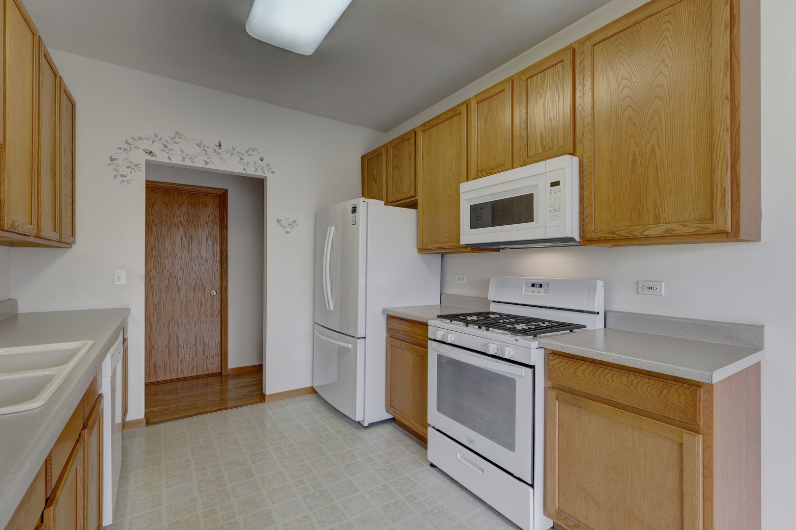 3206 Chestnut Drive McHenry, IL 60051 - Photo 8 of 30 a kitchen with a stove microwave and refrigerator