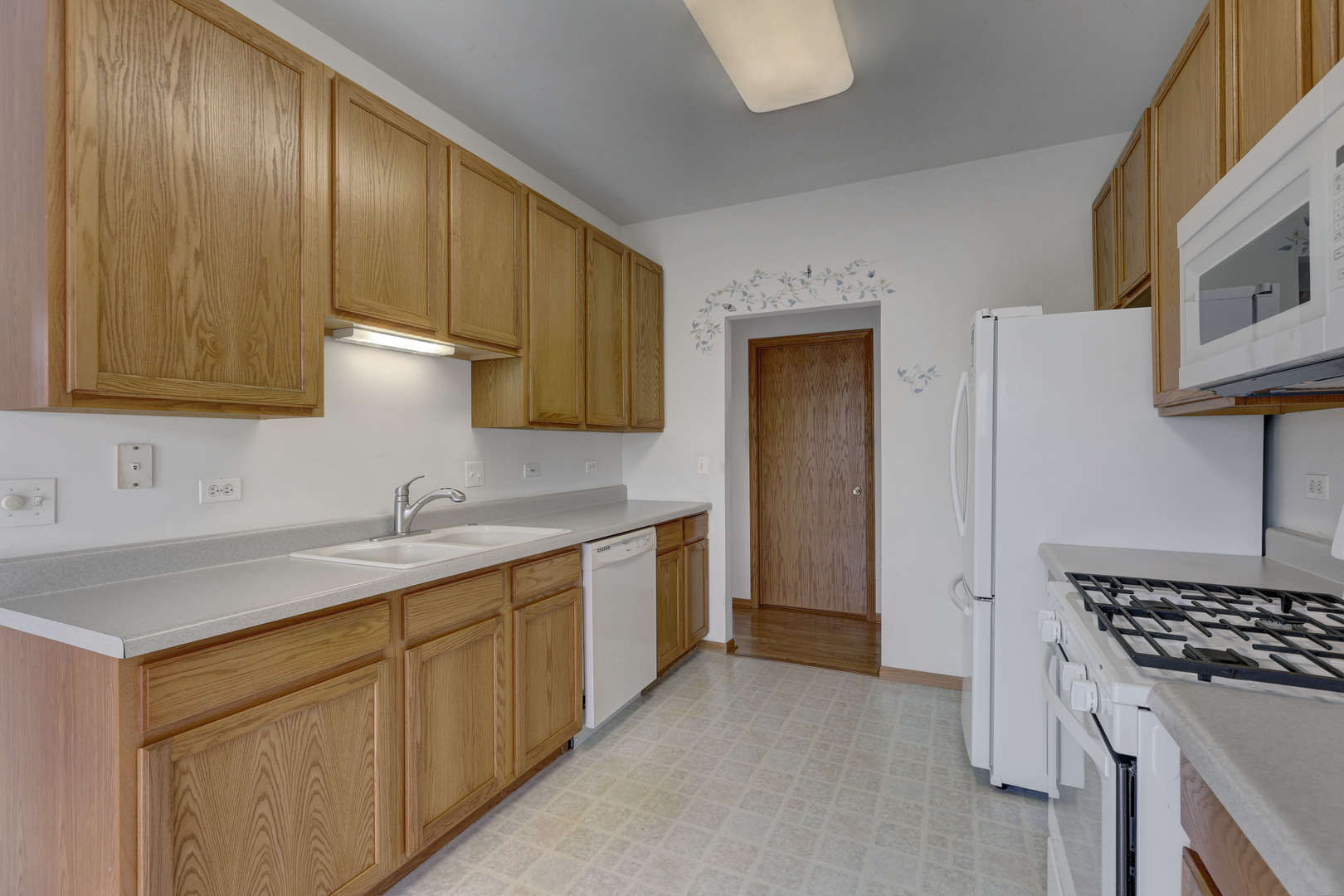 3206 Chestnut Drive McHenry, IL 60051 - Photo 9 of 30 a kitchen with a sink stove and cabinets