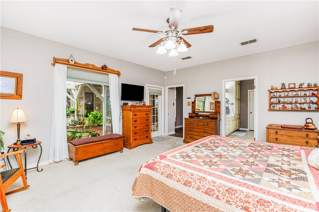 345 Trail Ridge Drive Sandia, TX 78383 - Photo 27 of 40 a bedroom with furniture and a flat screen tv