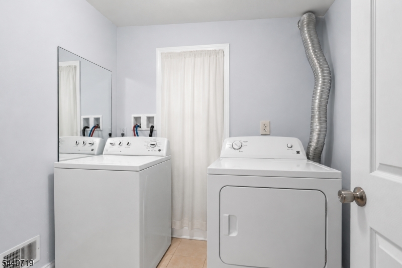 136 Smith Street Elizabeth, NJ 07201 - Photo 12 of 38 a utility room with dryer and washer