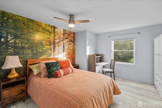 a bedroom with a bed and a chair