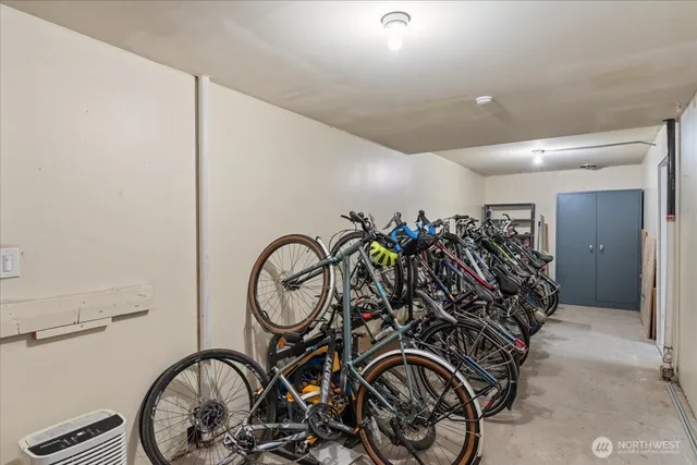 a room with furniture pool table and windows