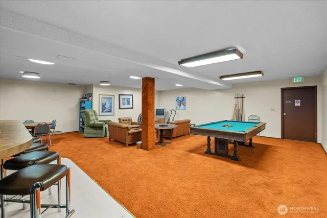 a view of a hallway with stairs