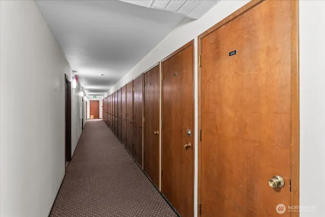 a view of a lake with houses in the back