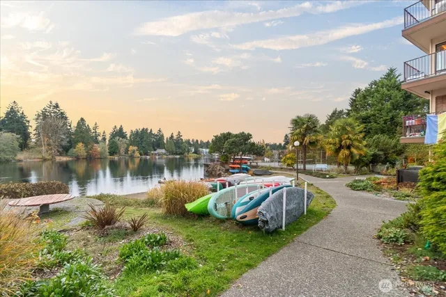 a view of swimming pool with outdoor seating and plants