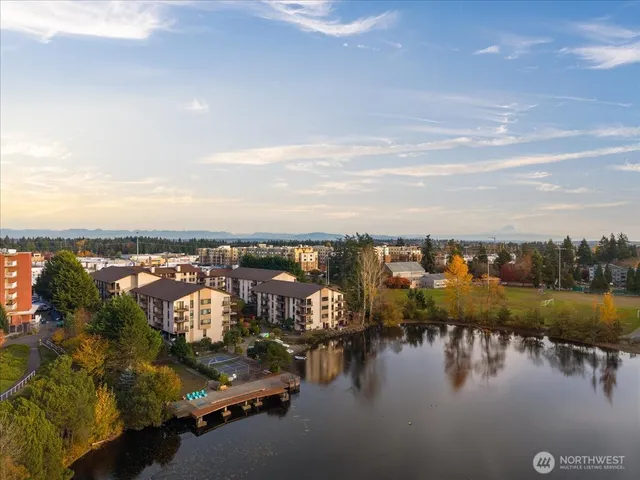 a city view with tall buildings and lake view