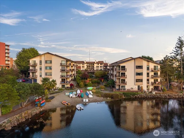 an aerial view of a house with a garden and statue