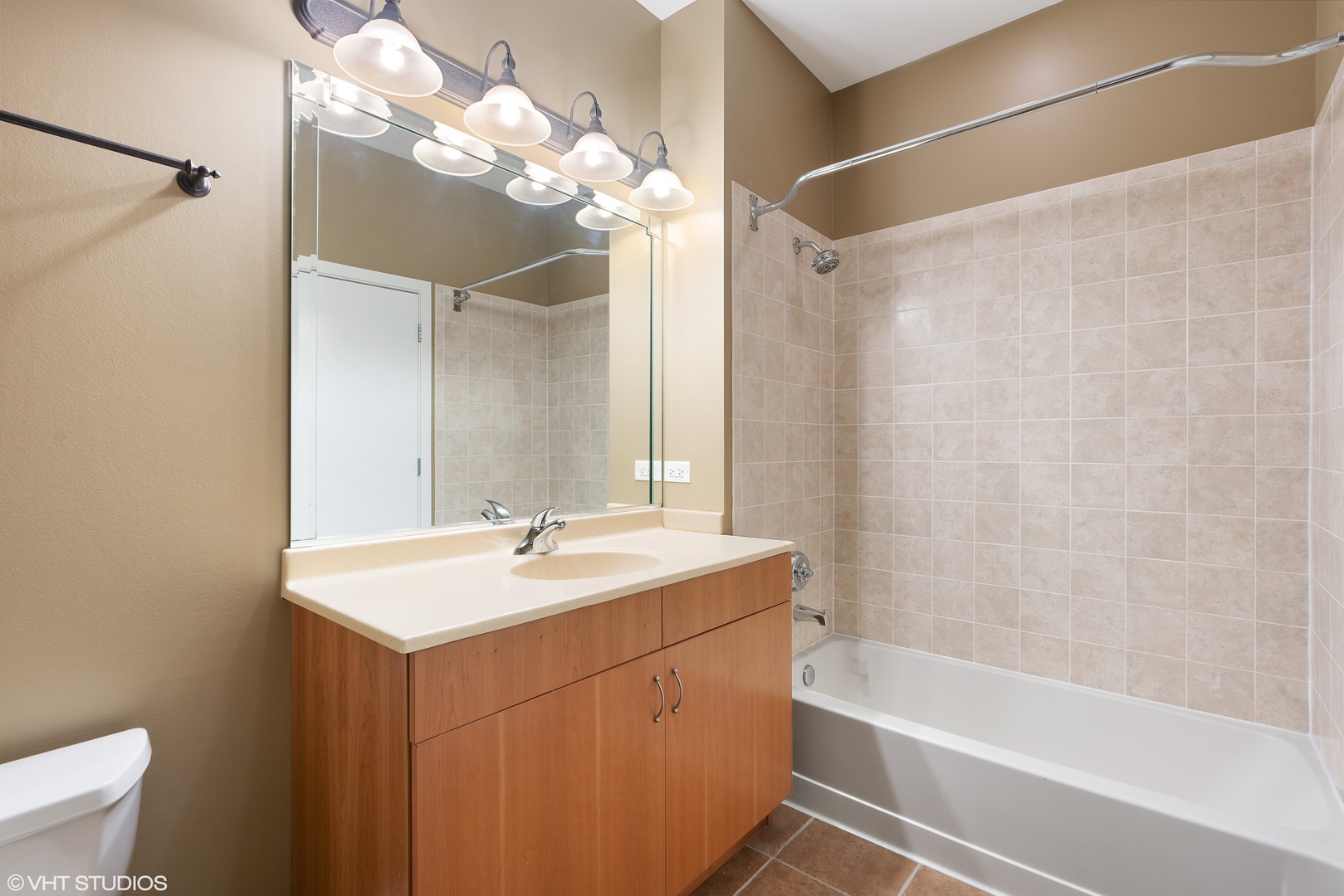 1509 South Halsted Street, Unit 211 Chicago, IL 60607 - Photo 11 of 13 a bathroom with a sink a toilet and shower