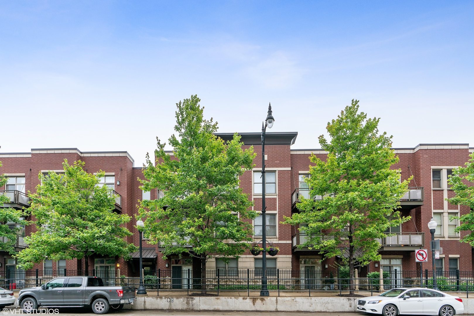 1509 South Halsted Street, Unit 211 Chicago, IL 60607 - Photo 13 of 13 a view of a building and trees in the background