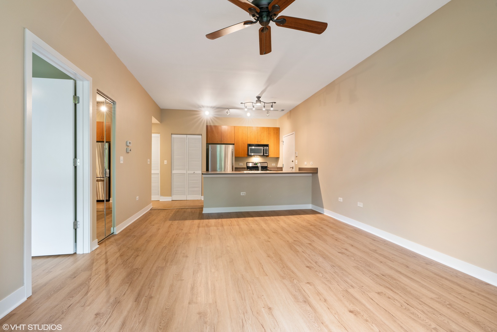 1509 South Halsted Street, Unit 211 Chicago, IL 60607 - Photo 4 of 13 a view of a kitchen with a sink and a window