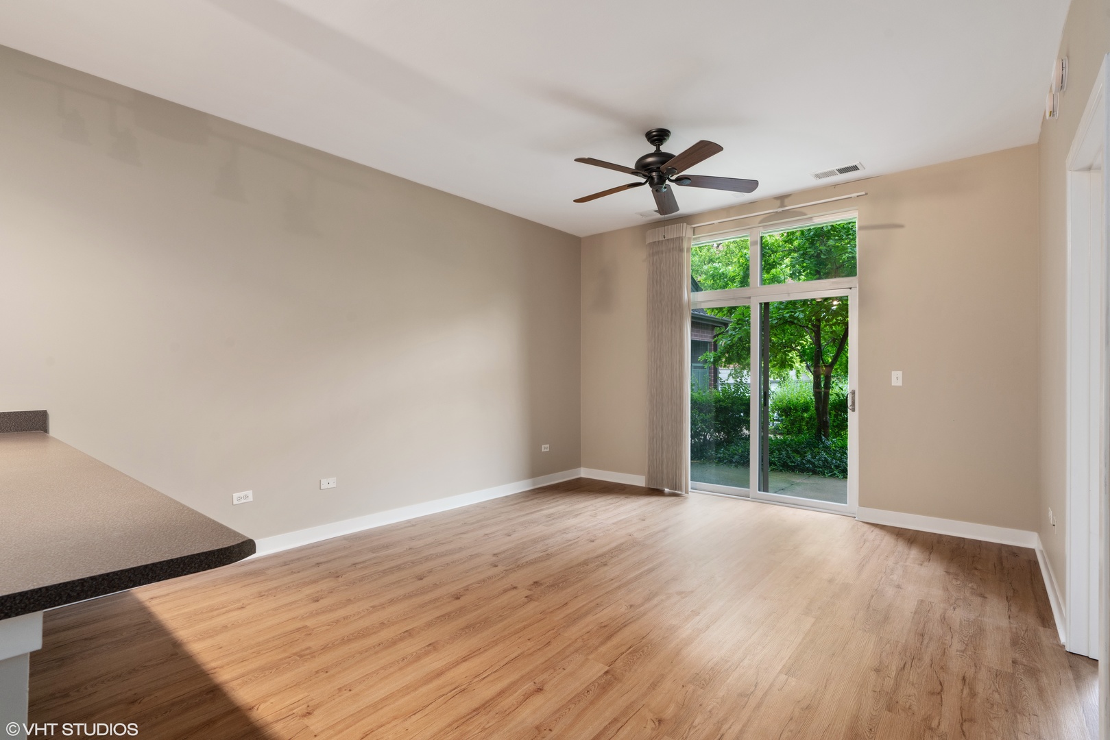 1509 South Halsted Street, Unit 211 Chicago, IL 60607 - Photo 7 of 13 wooden floor in an empty room with a window