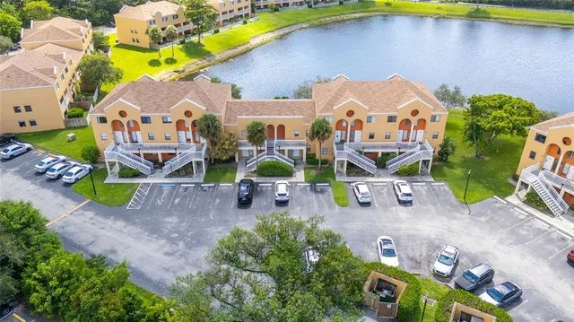 an aerial view of a house with a swimming pool