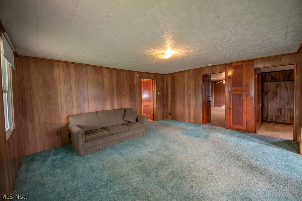 2468 Tabor Ridge Road Northeast New Philadelphia, OH 44663 - Photo 17 of 33 Spacious open-concept living area providing natural light, and carpeted flooring throughout