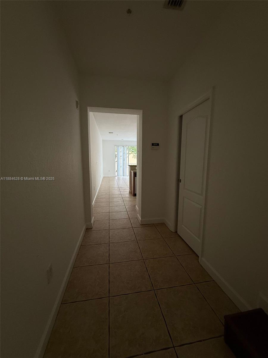 17640 Northwest 73rd Avenue, Unit 20019 Hialeah, FL 33015 - Photo 6 of 8 a view of hallway with an empty space