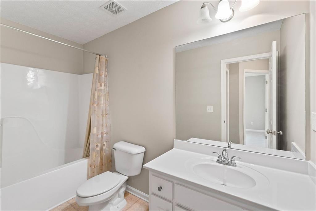 241 Red Bud Road Jefferson, GA 30549 - Photo 36 of 43 a bathroom with a sink toilet and shower