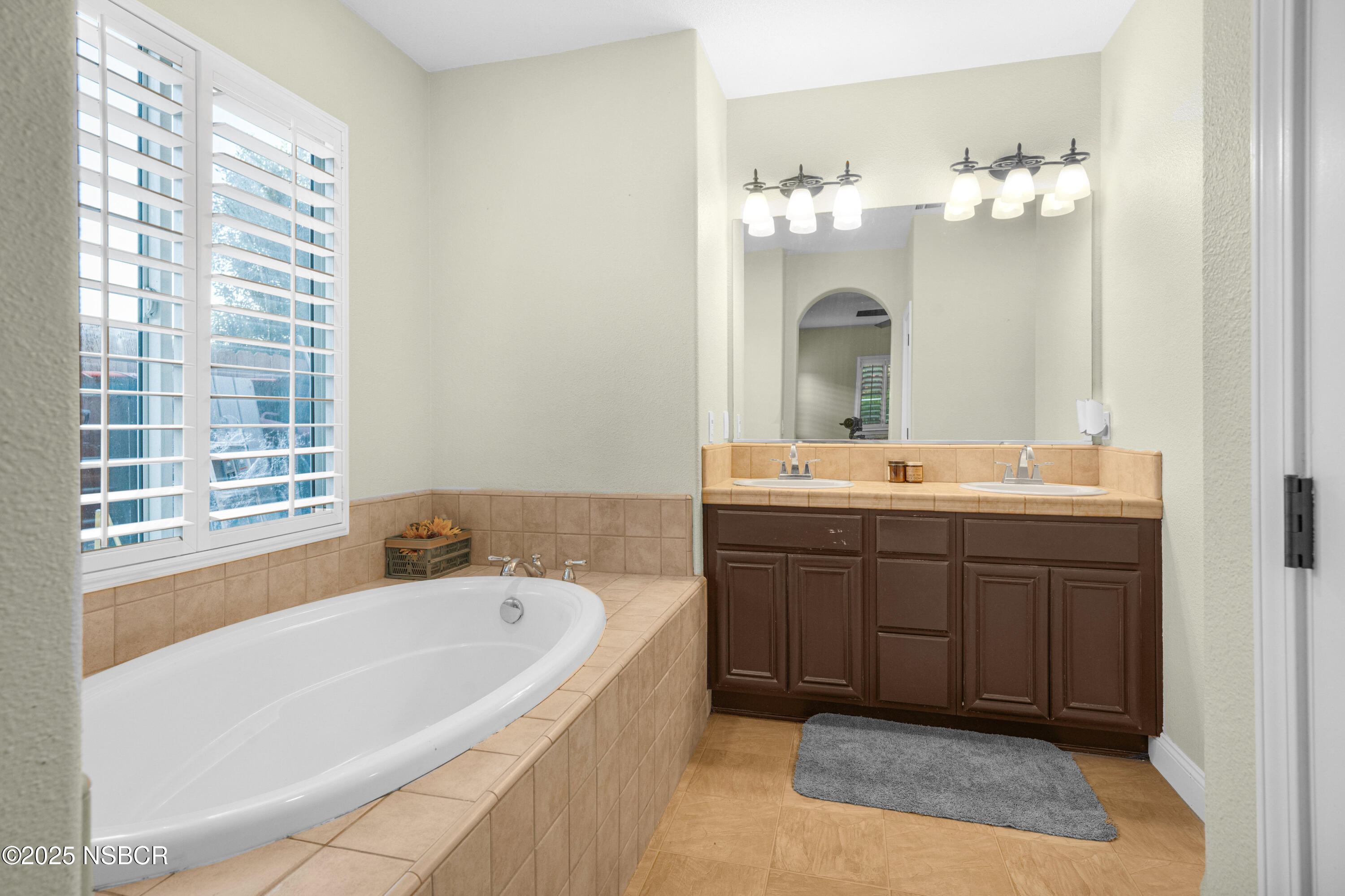 758 Voyager Road Lompoc, CA 93436 - Photo 24 of 46 a spacious bathroom with a tub sink and mirror