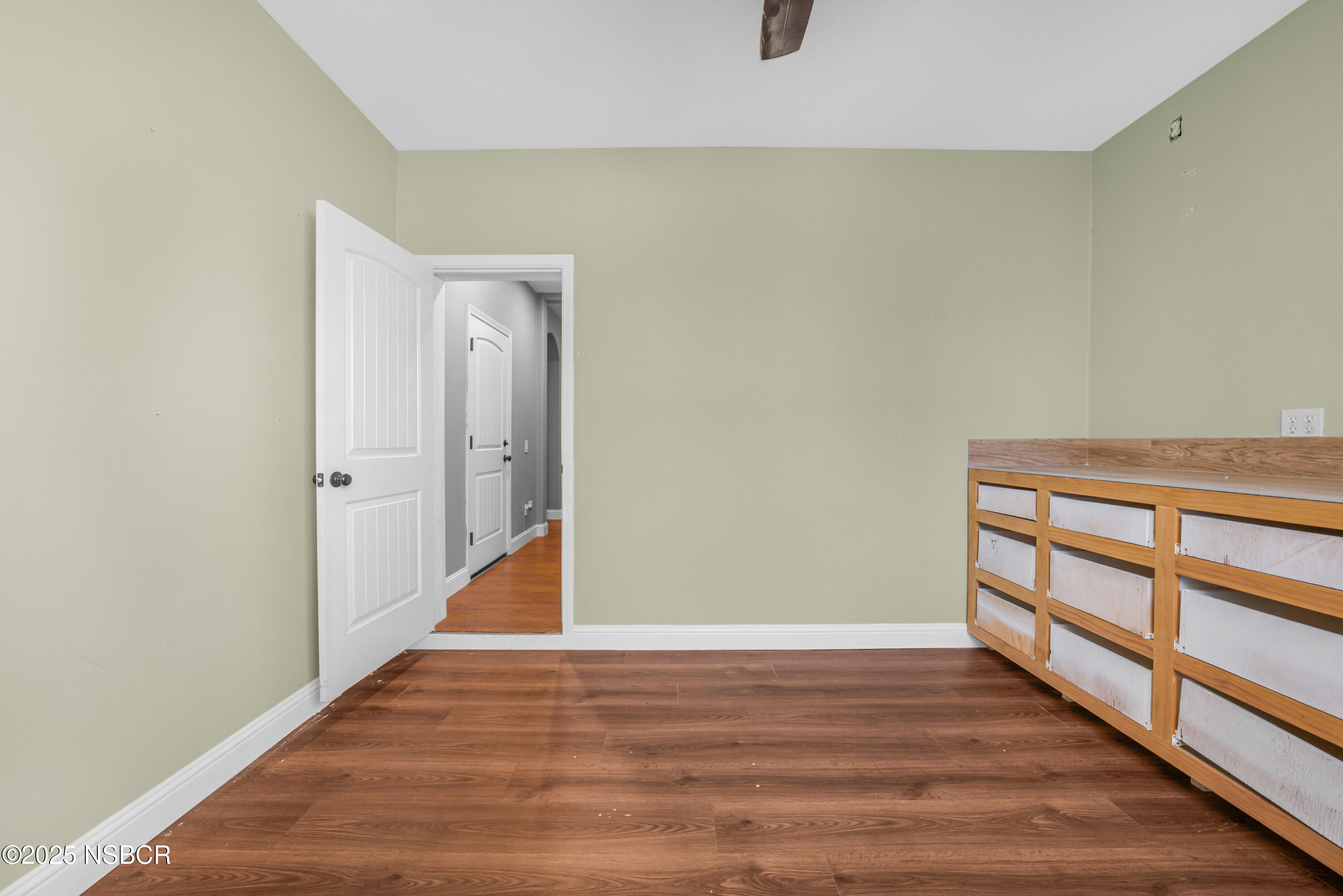 758 Voyager Road Lompoc, CA 93436 - Photo 35 of 46 a view of a hallway with wooden floor
