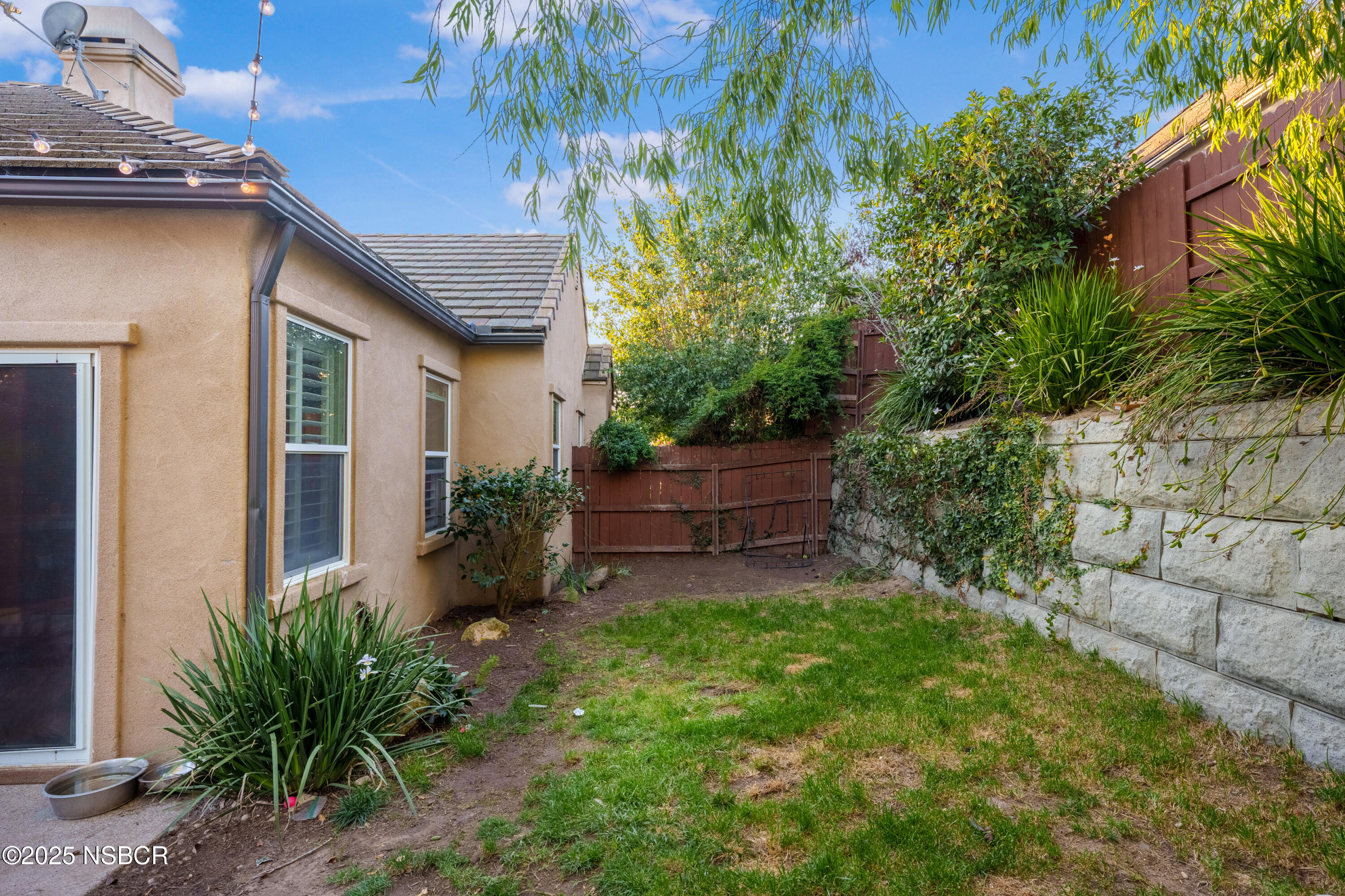 758 Voyager Road Lompoc, CA 93436 - Photo 37 of 46 a backyard of a house with plants and tree