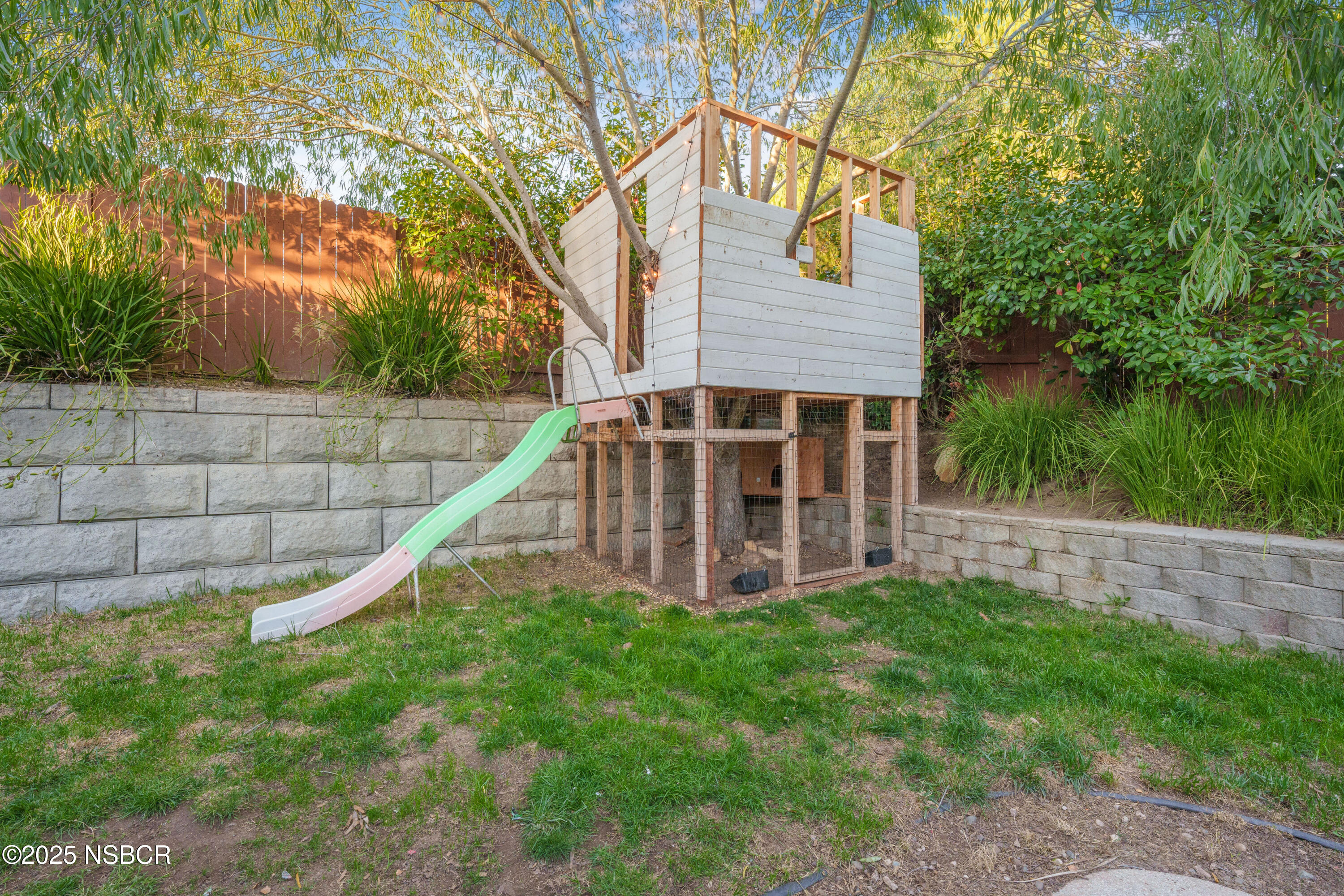 758 Voyager Road Lompoc, CA 93436 - Photo 42 of 46 a view of a house with backyard and a tree