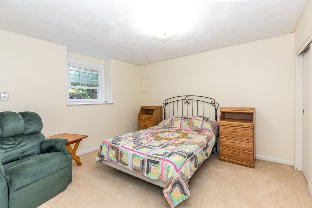 3 Stage Road Billerica, MA 01862 - Photo 19 of 26 a bedroom with a bed couch and a window