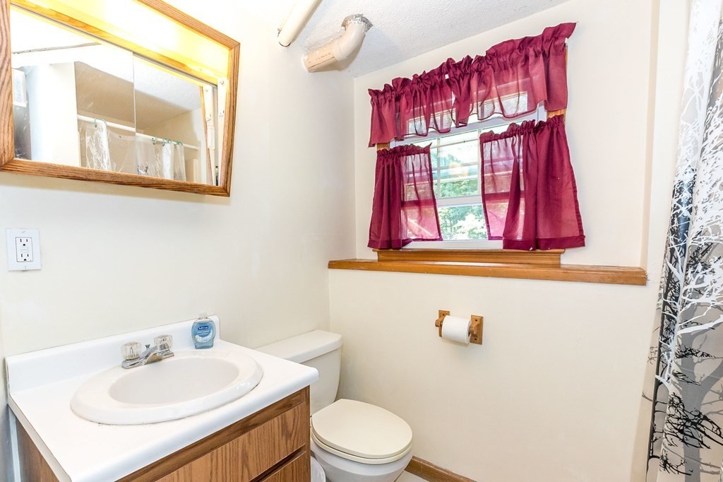 3 Stage Road Billerica, MA 01862 - Photo 21 of 26 a bathroom with a sink and a mirror