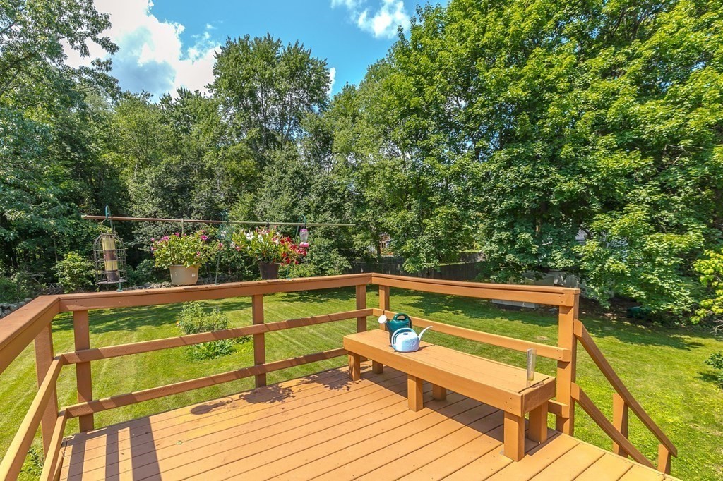 3 Stage Road Billerica, MA 01862 - Photo 23 of 26 a view of deck with a table and chairs and wooden floor