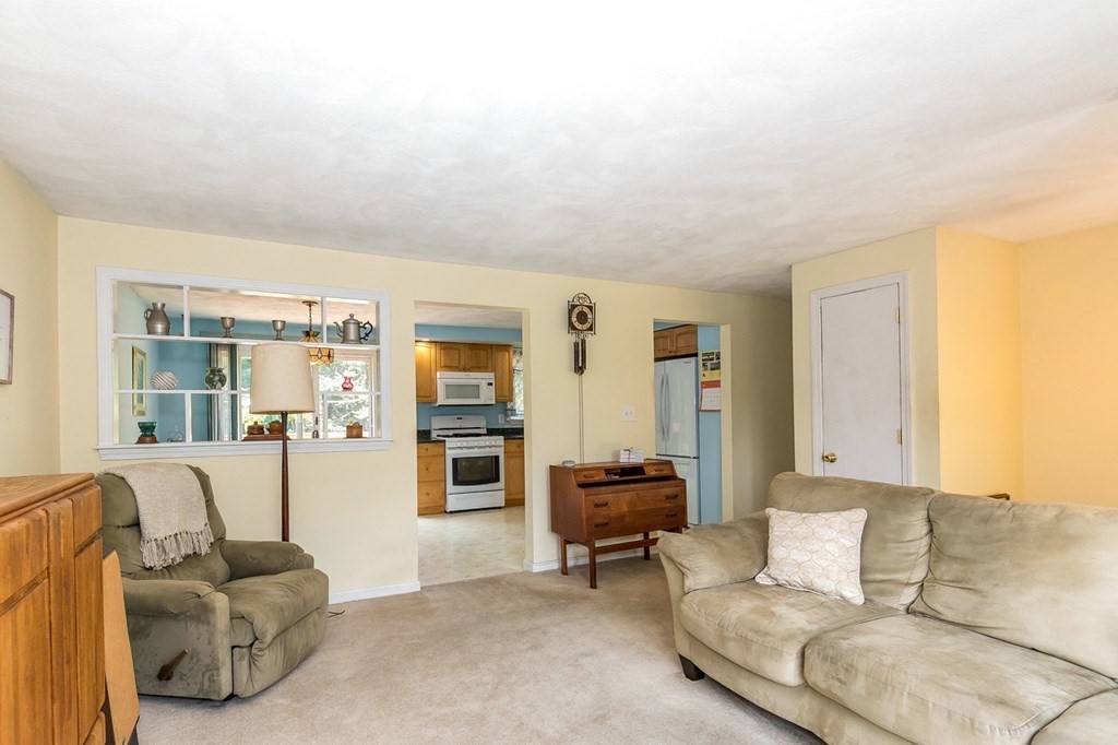 3 Stage Road Billerica, MA 01862 - Photo 3 of 26 a living room with furniture and a large window