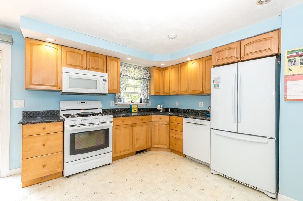 3 Stage Road Billerica, MA 01862 - Photo 10 of 26 a kitchen with granite countertop white cabinets and white appliances