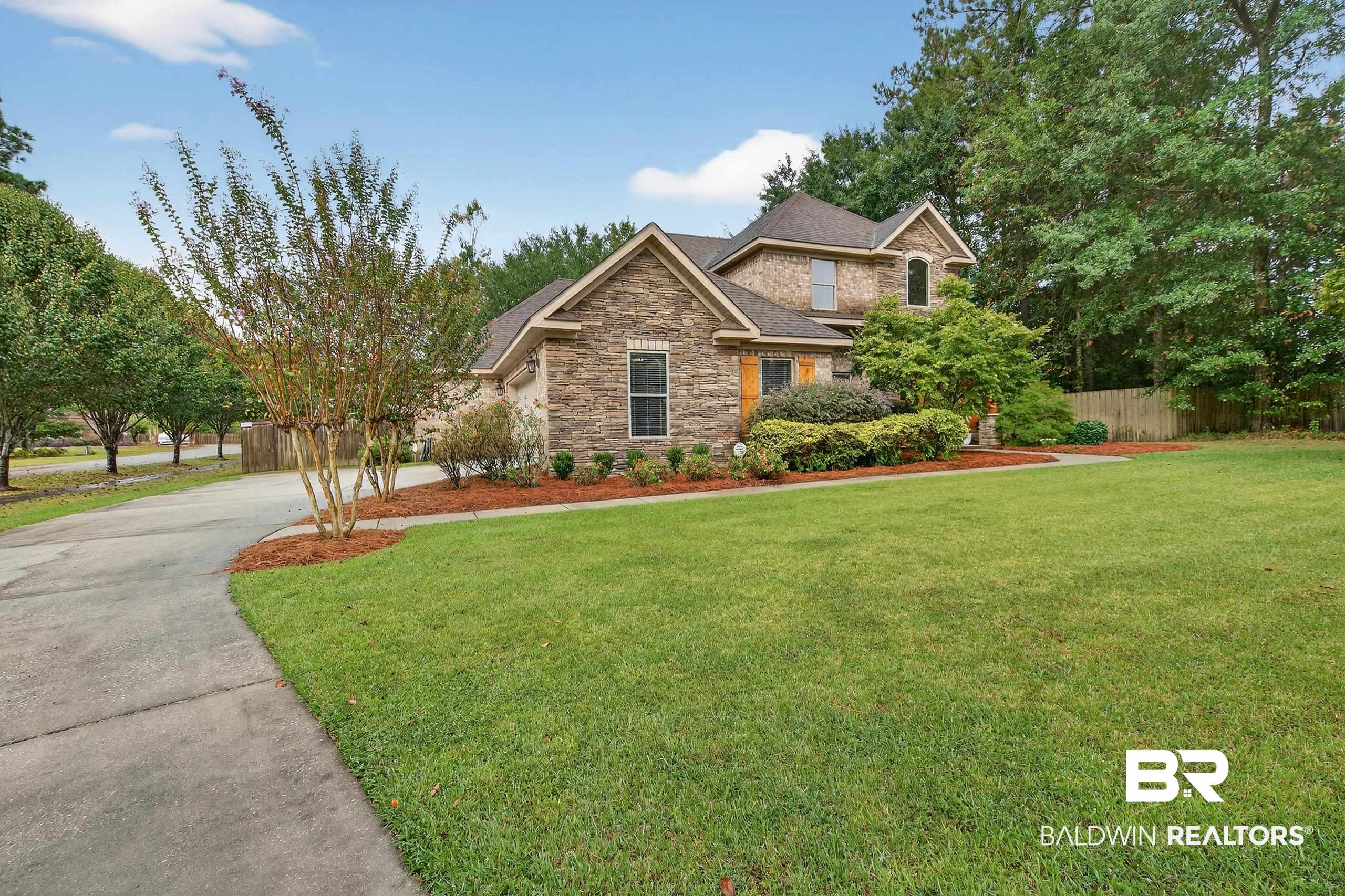 5517 Rabbit Creek Drive Theodore, AL 36582 - Photo 2 of 33 Craftsman-style house featuring stone siding and driveway