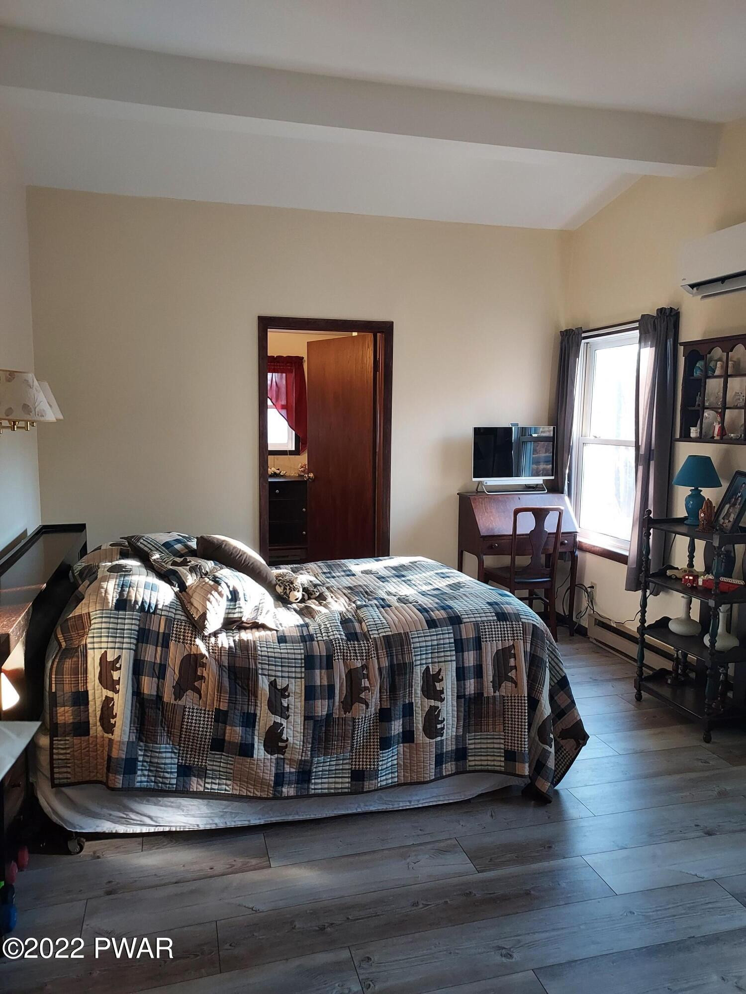 111 Rodeo Lane Hawley, PA 18428 - Photo 15 of 23 a bedroom with furniture and wooden floor