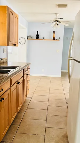 a kitchen with a cabinets and window
