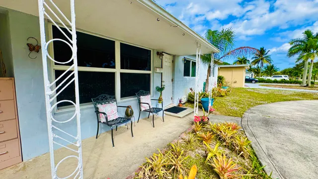 a view of a patio with swimming pool table and chairs