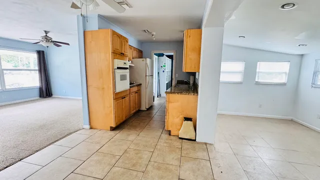a view of a kitchen with furniture and a kitchen