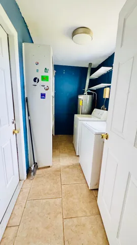 a view of hallway with washer and dryer