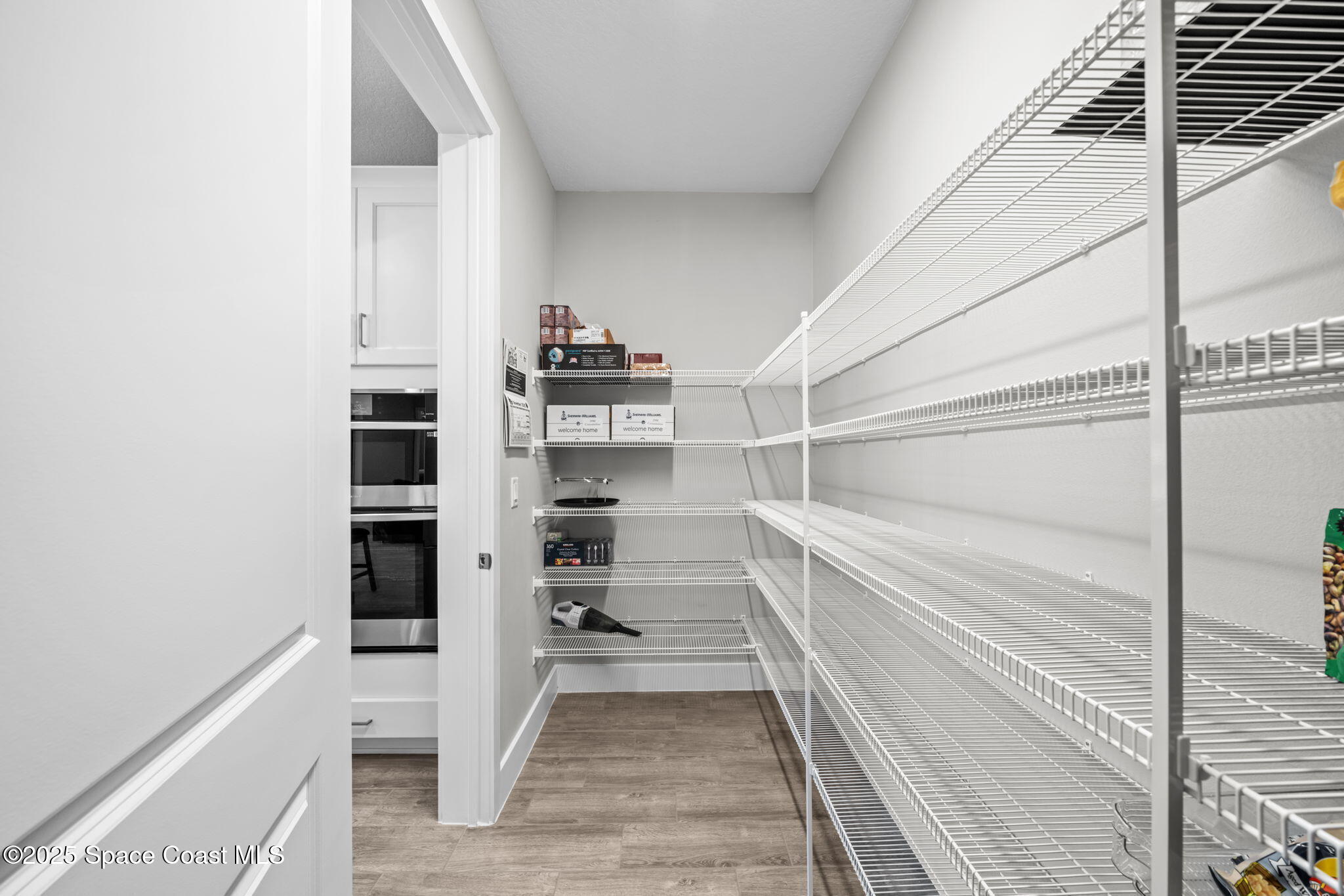 2846 Silverlefe Lane Melbourne, FL 32940 - Photo 13 of 58 a view of walk in closet with empty racks