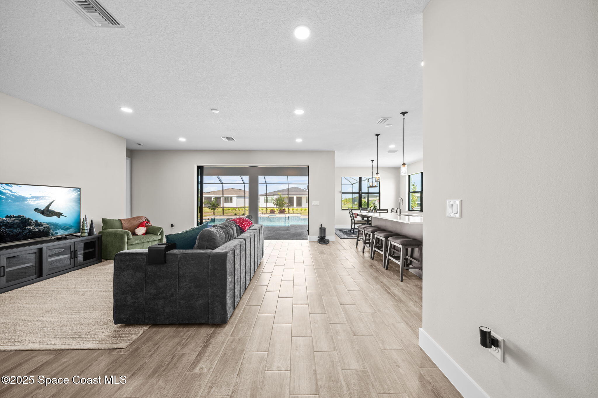 2846 Silverlefe Lane Melbourne, FL 32940 - Photo 14 of 58 a living room with furniture and a flat screen tv