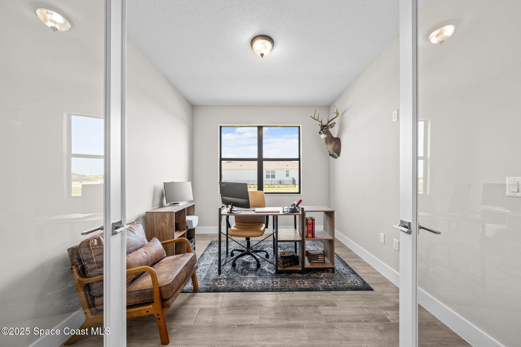 2846 Silverlefe Lane Melbourne, FL 32940 - Photo 17 of 58 a living room with furniture and a window