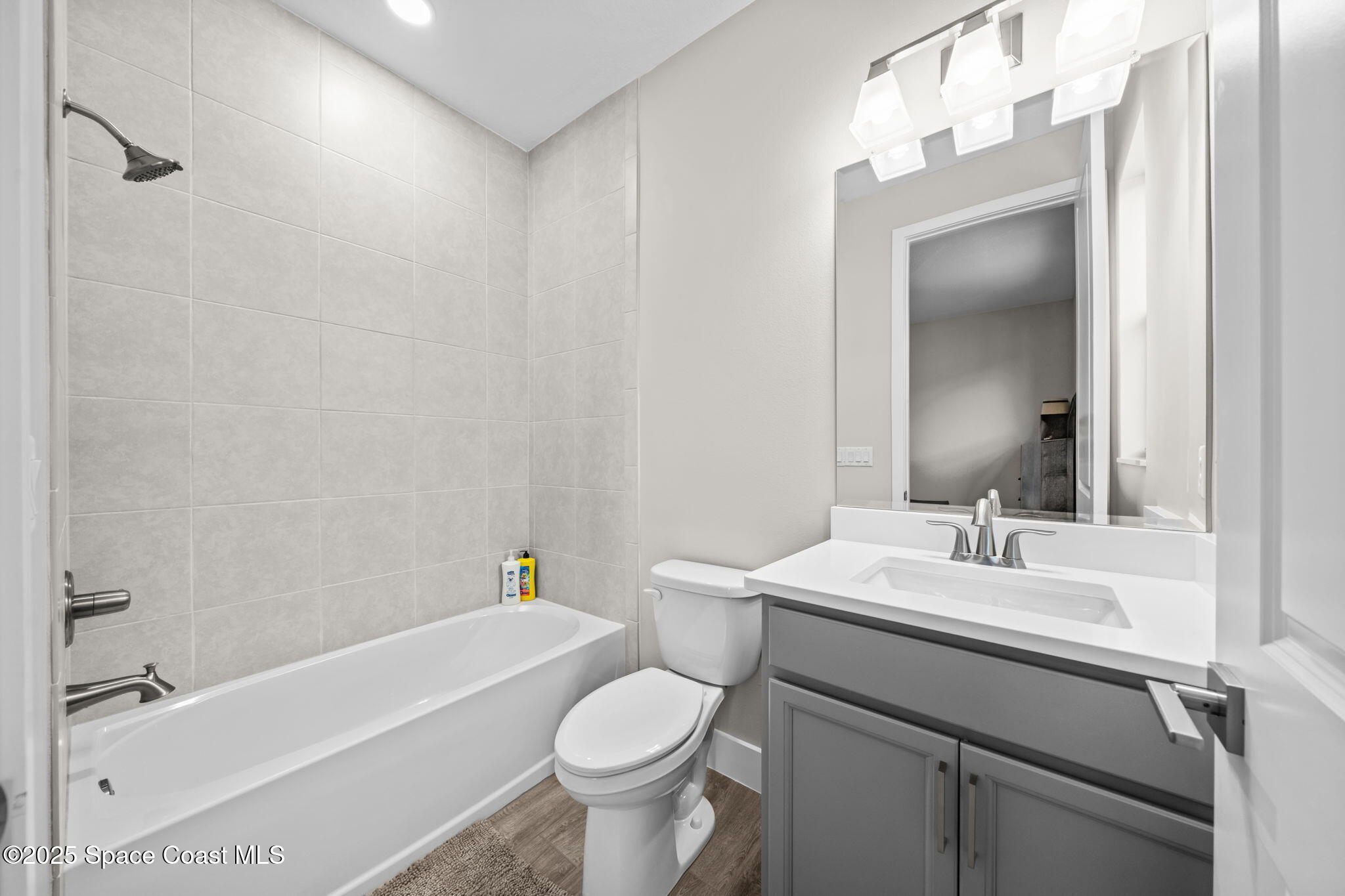 2846 Silverlefe Lane Melbourne, FL 32940 - Photo 32 of 58 a bathroom with a sink toilet and shower