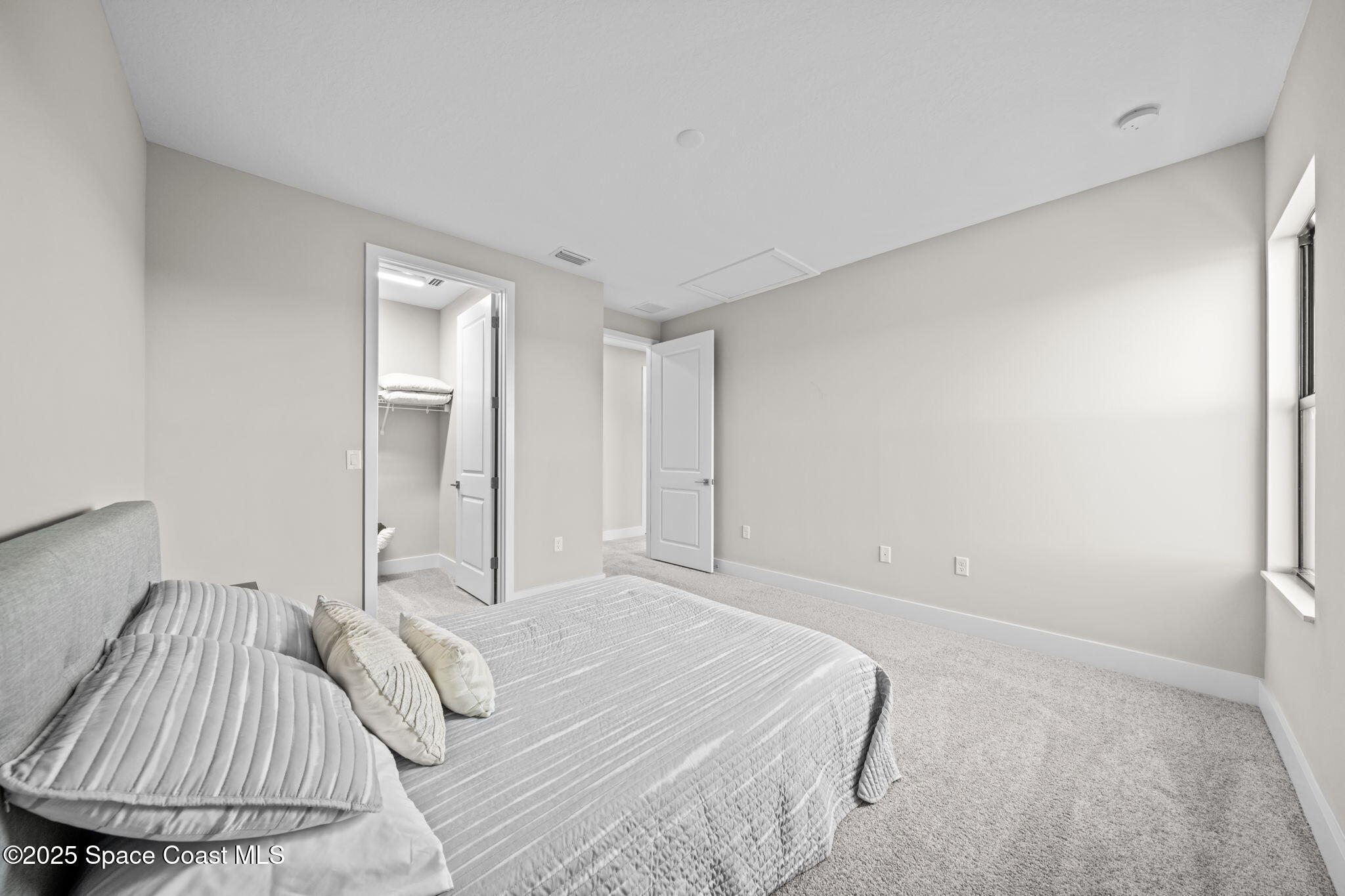 2846 Silverlefe Lane Melbourne, FL 32940 - Photo 35 of 58 a bedroom with a bed and a couch