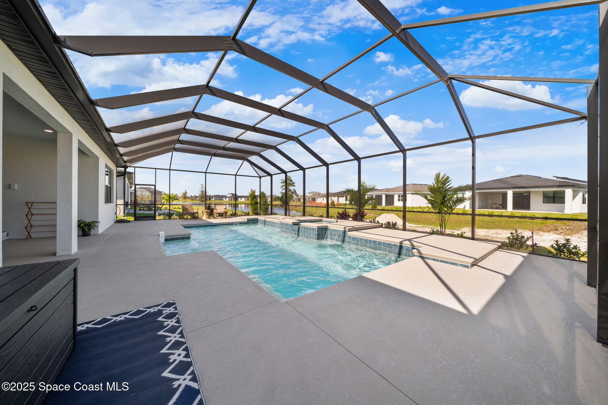2846 Silverlefe Lane Melbourne, FL 32940 - Photo 47 of 58 a view of a swimming pool with a patio