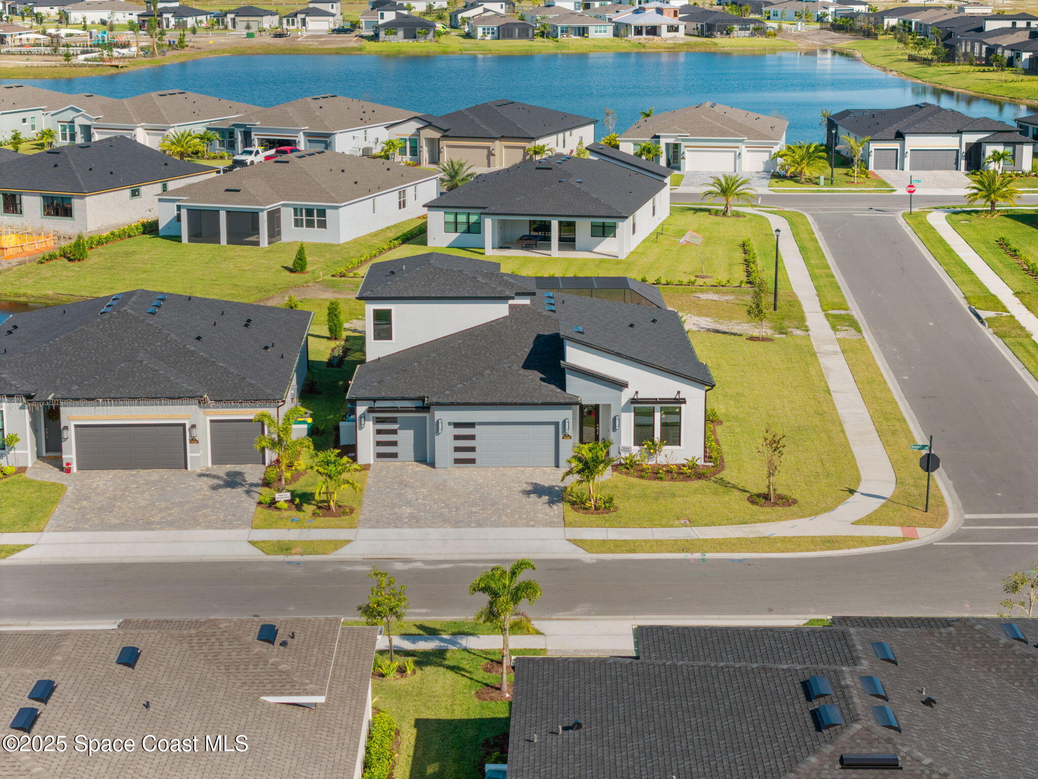 2846 Silverlefe Lane Melbourne, FL 32940 - Photo 55 of 58 a aerial view of a house with a swimming pool outdoor seating and yard