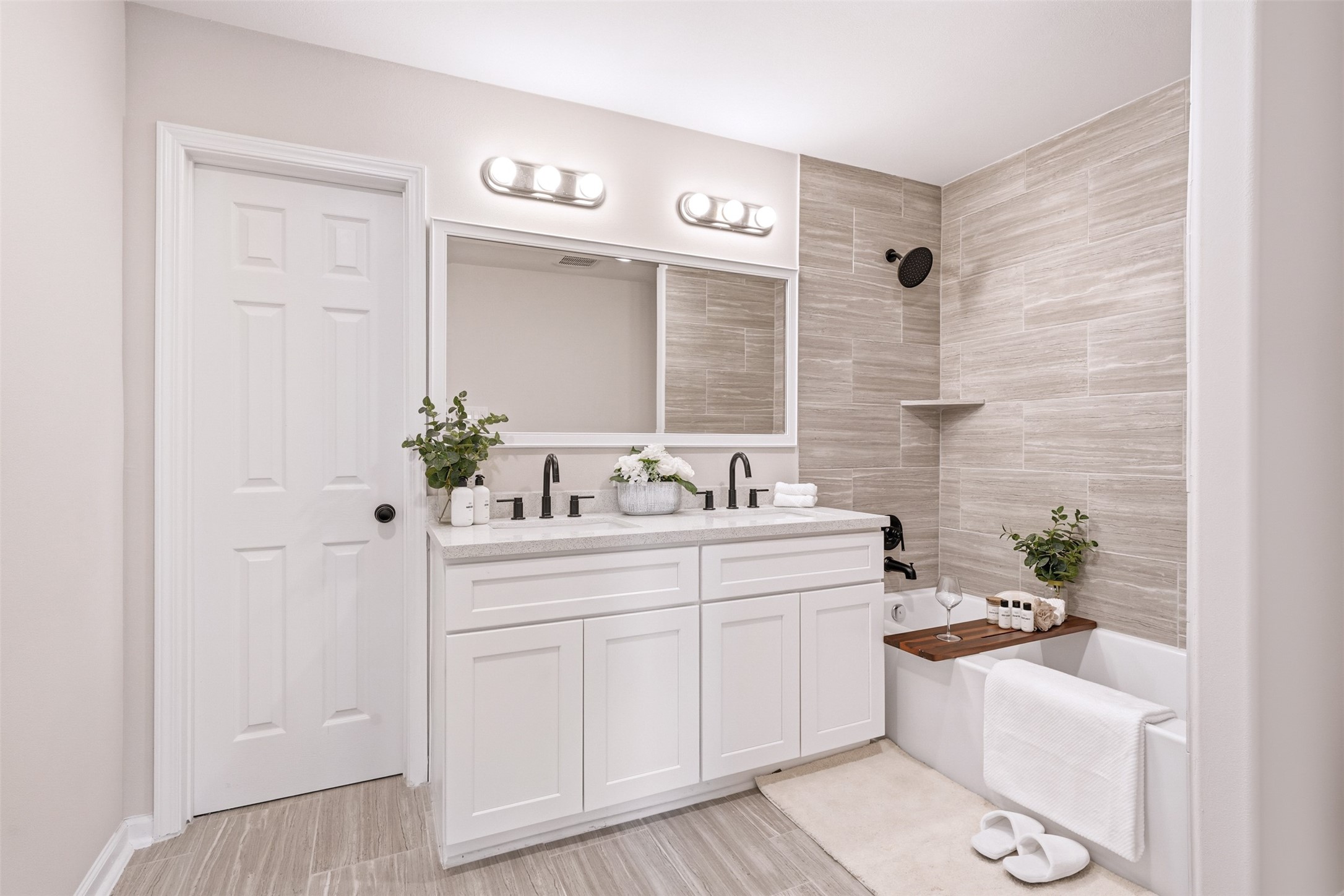 6111 Haight Street Houston, TX 77028 - Photo 7 of 21 a bathroom with a sink a large mirror and a shower