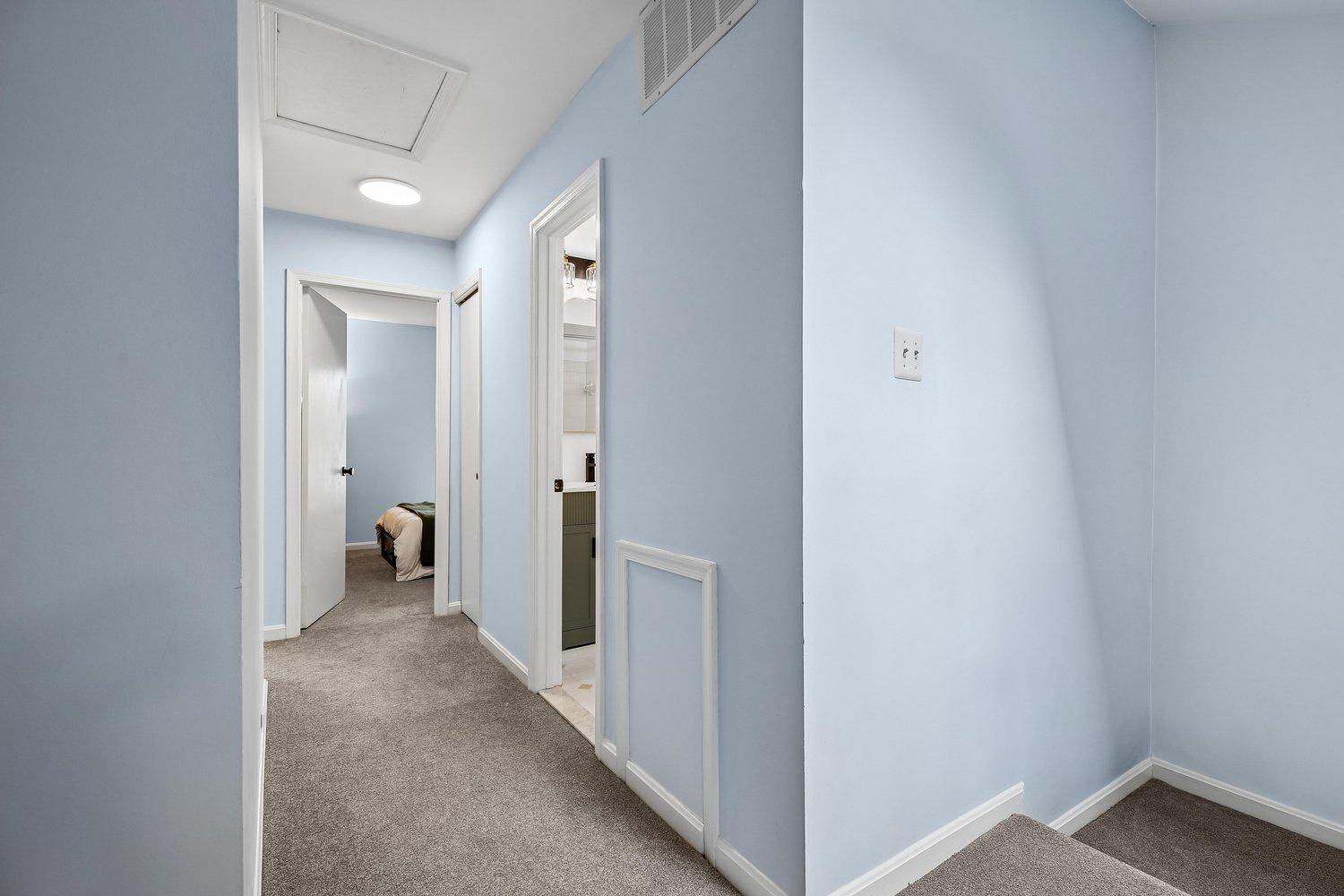 1406 Casino Circle Silver Spring, MD 20906 - Photo 26 of 64 Upstairs hallway with soft blue walls.